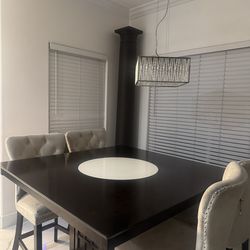 Dining table with 4 chairs and wine glass storage