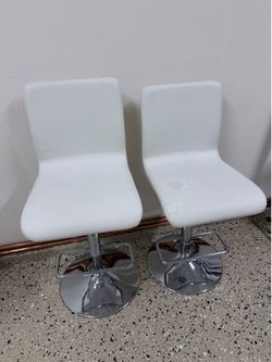 2 White Adjustable Bar Stools – One Has Peeling Faux Leather