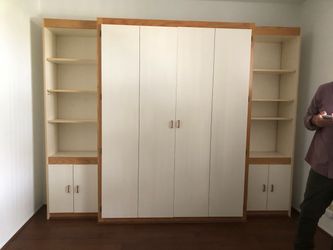 Murphy Bed Rarely Used w/Attached Cabinets. Wall Unit.