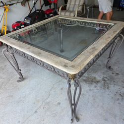 Wrought Iron Glass Top marble edged Dining Table.