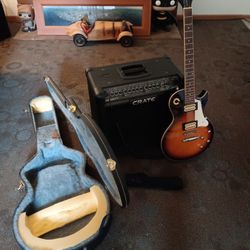 CRATE sunburst color electric guitar with 65 watt CRATE amp and hard case and CRATE foot switch controls plays great 