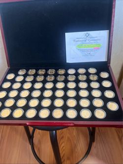 New US State and Territories gold layer P and D quarter set in cases.