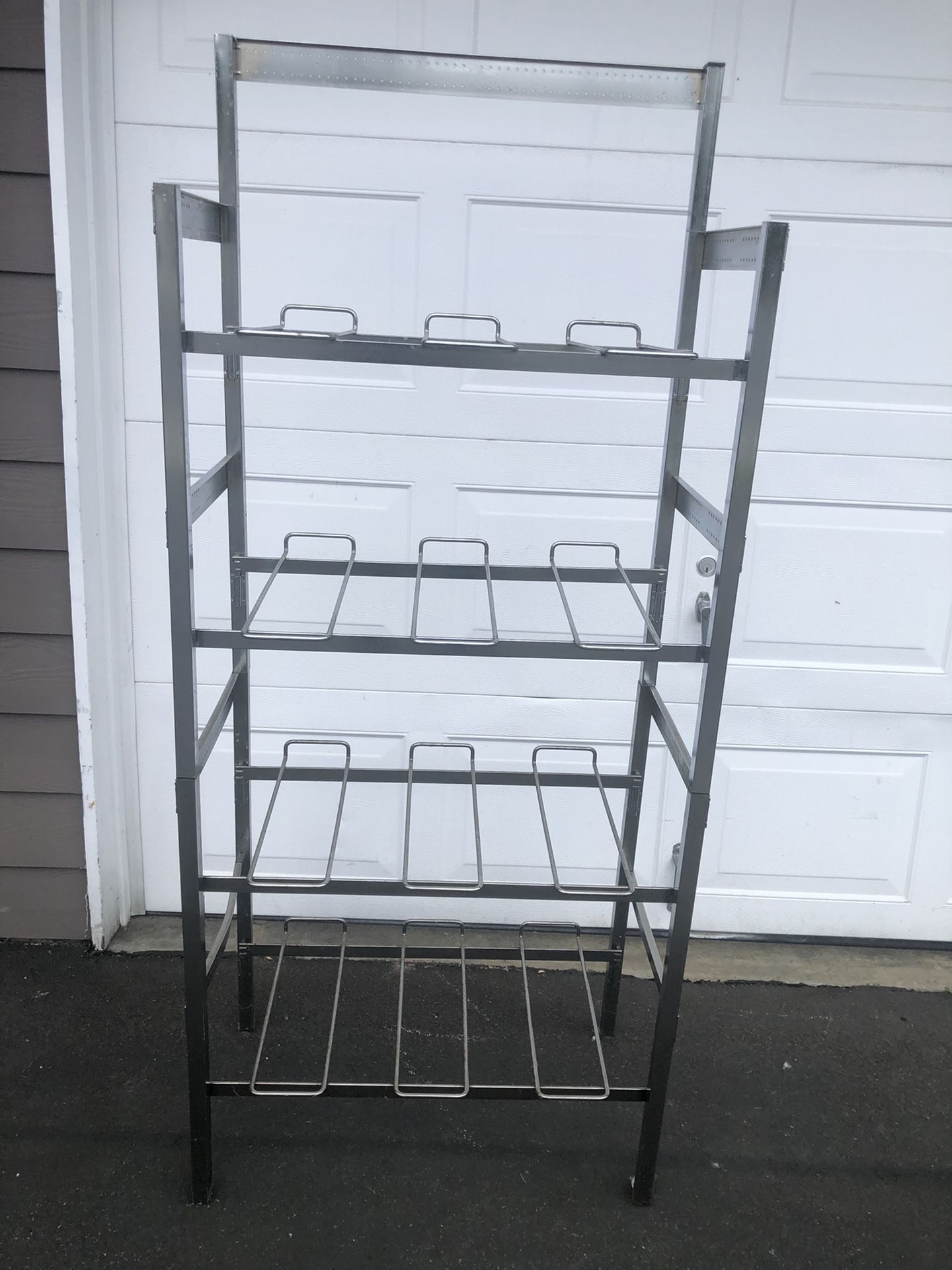 Stainless steel shelf 4 Layers ... asking for $21 cash only.. you can use it for or in your Kitchen or in your garage... 57” high.. 28” width and 1