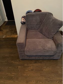 Single couch non reclining like new with pillow cushion