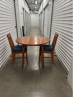 Small solid wood dinning room table with two chairs
