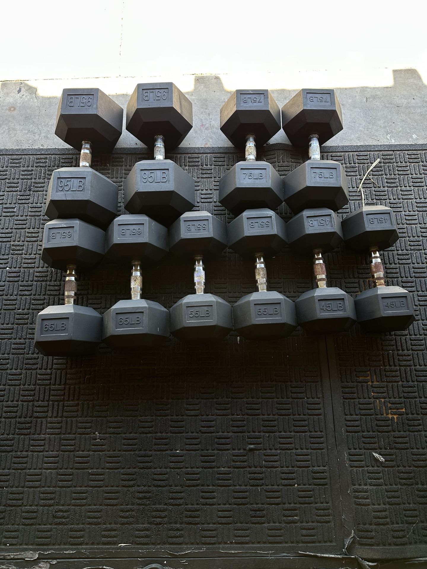 Pairs of 95,75,65,55,45 dumbbells weights 670lbs total 