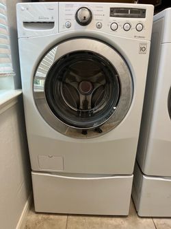 LG TrueSteam Stackable Front Load Washer and Electric Dryer Set with Matching Drawer Pedestals