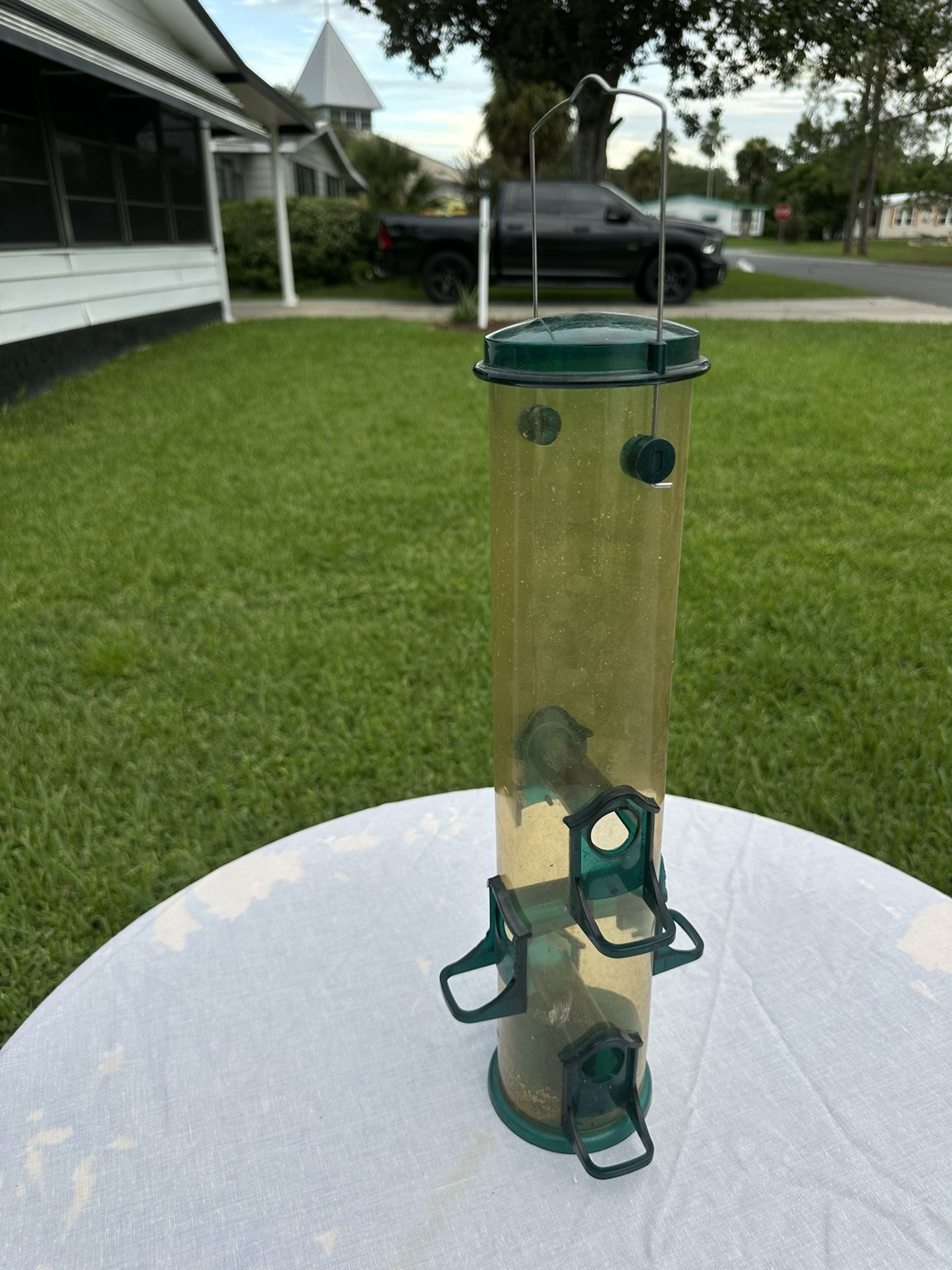 Green Plastic Tube-Style Bird Feeder With Multiple Perches