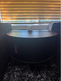 Round coffee table with storage