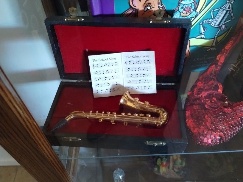 miniature saxophone in case