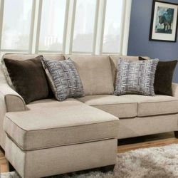 New Taupe Sectional With Reversible Chaise And Pillows
