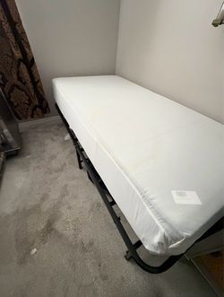 Practically new  twin mattress with a trundle frame!