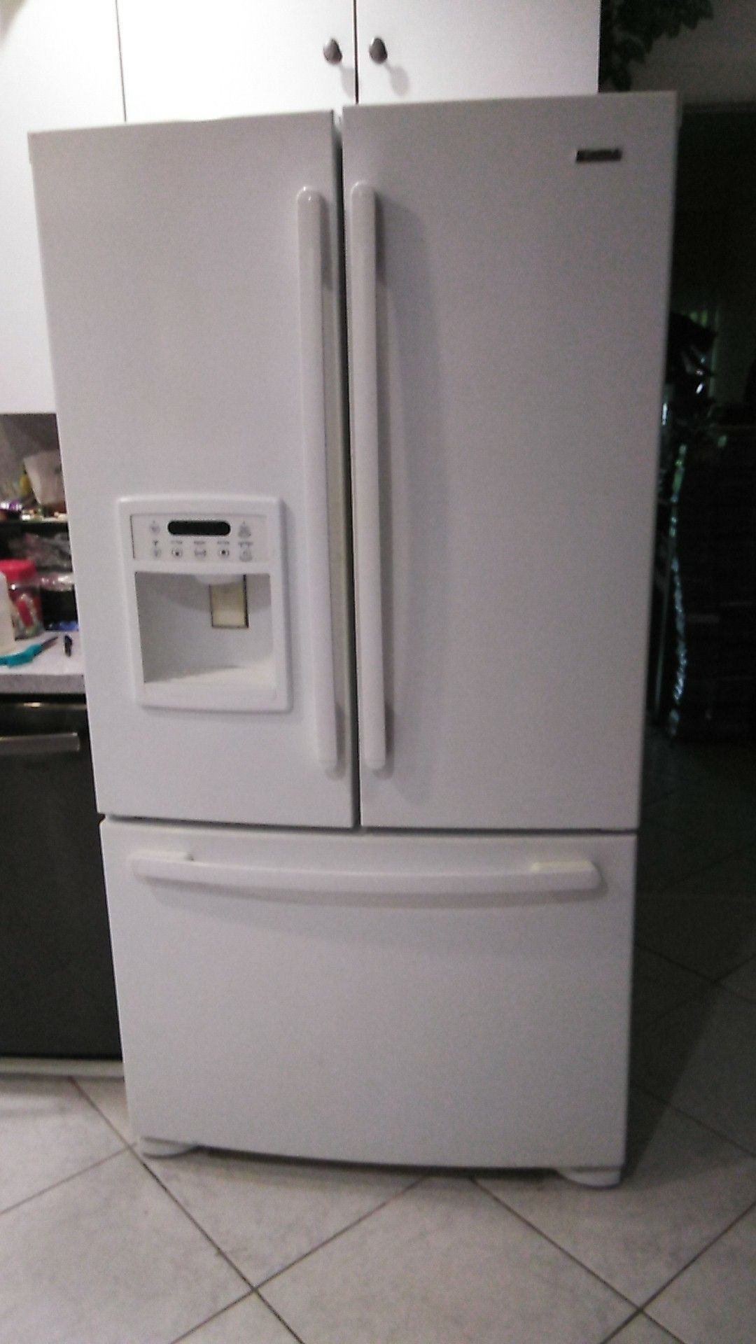 Refrigerator, ice+ water on door, 26cu ft. Bottom freezer,works great