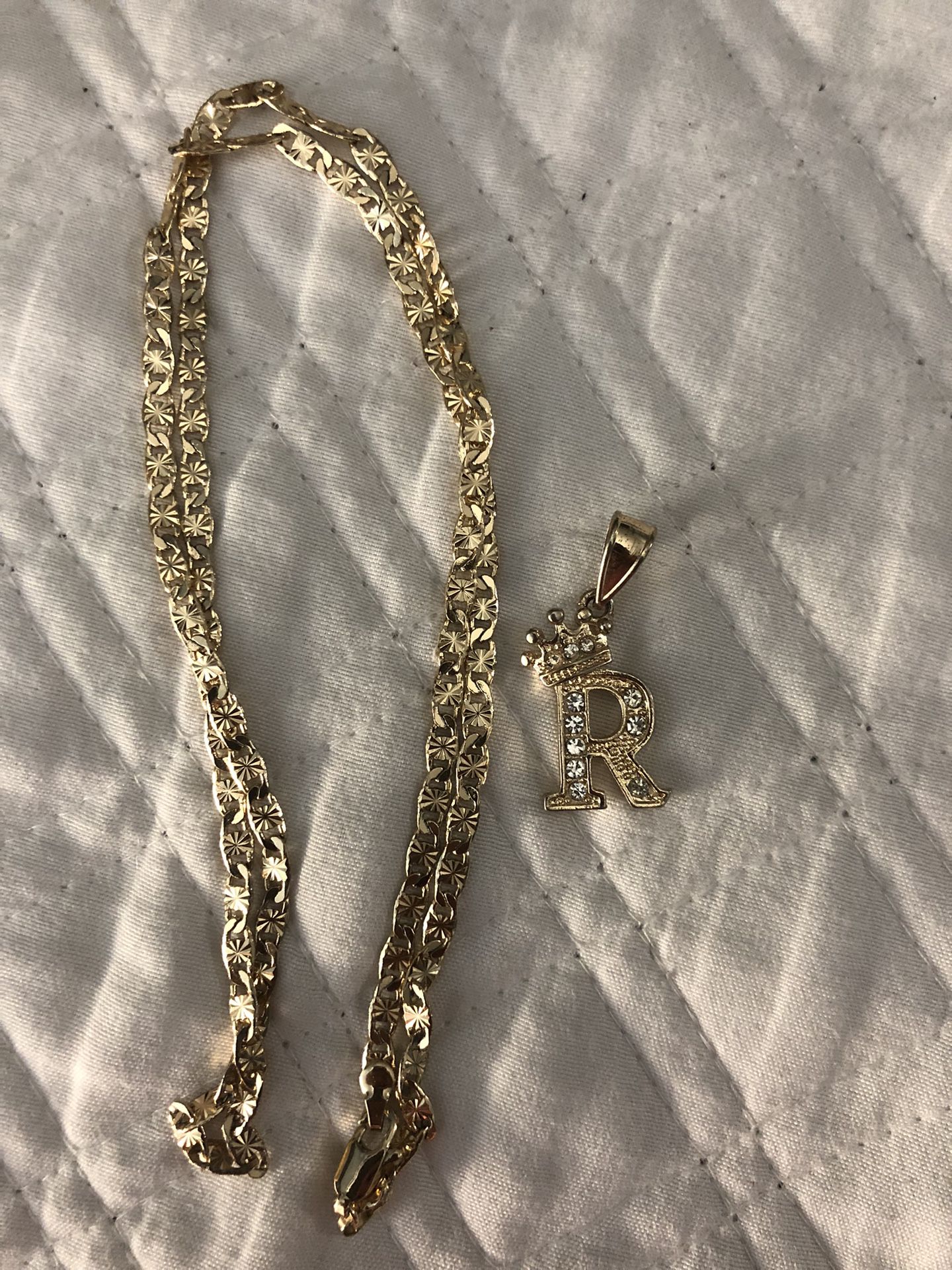 gold chain with “r” initial 