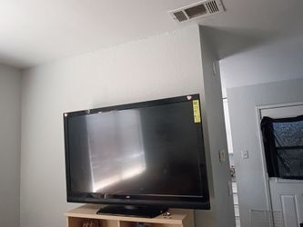 Two brand new queen beds used for only three months with mattresses, a table, a dresser, and two TVs. Everything for 300.