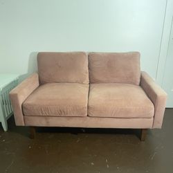 pink velvety loveseat couch
