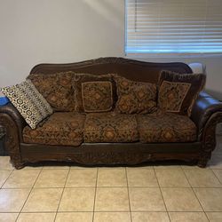 Brown leather couch with vintage trimming 