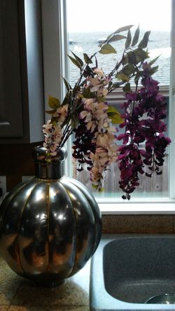 Unique metal vase. Will look great next to your metal bowl.