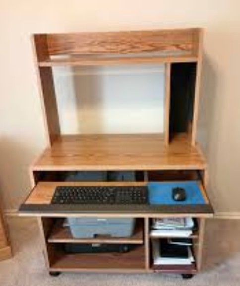 Delivery Avail 1980s rolling wood workstation computer desk 35"x20" 53" high
pull out tray rolling table