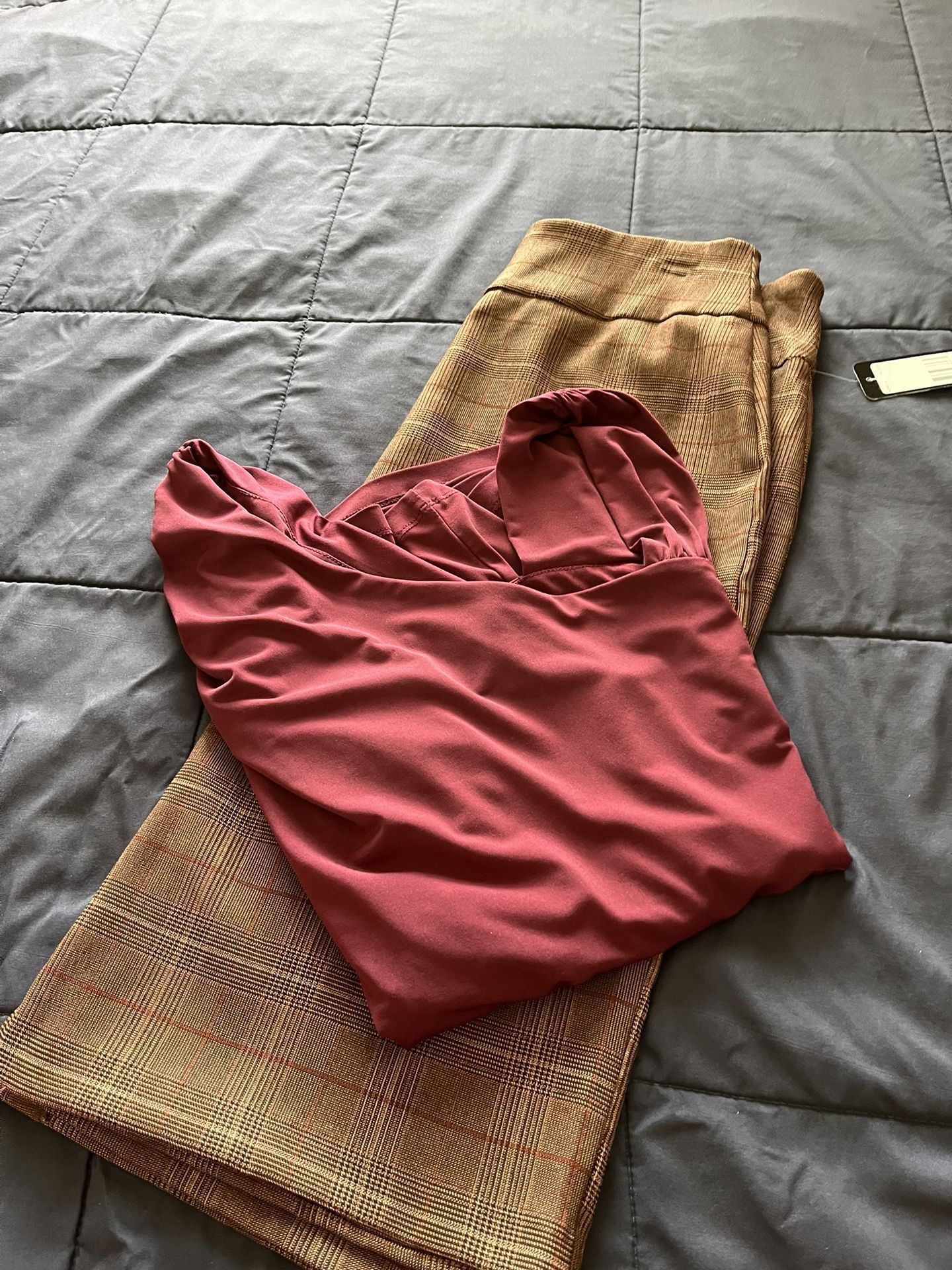 There Is A Two Pieces A skirt size, small and the blouse size large the color is burgundy, and the skirt is brown & Burgundy stripe both for $25 total