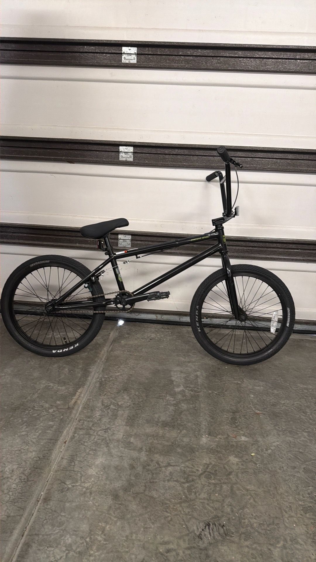 black Redline BMX bike with green accents.