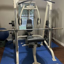 Home gym with bench, squat, flys, and lat pull down. Weights all included