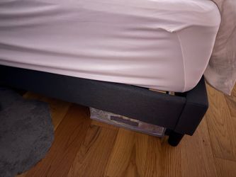 Grey upholstered king platform bed base