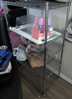 Brand new heavy duty  metal shelf with 5 shelfs  ( only used 2 hours ) .
