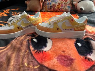 Woman’s size 6 custom Karol G Nikes.