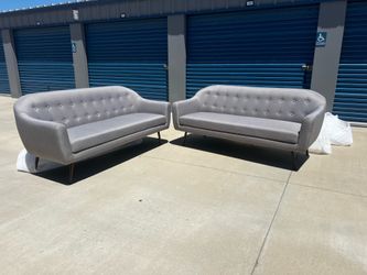 Brand New. (Set of 2) Mid Century Modern Sofa's.  $699. Light Grey