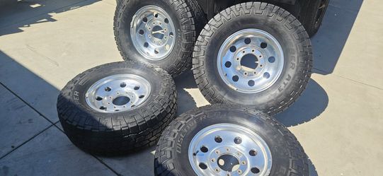 8x170 aluminum wheels - new Cooper tires  287/85/16