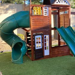  Your Playhouse With Two Slides, Three Swings Two-Story With A Climbing Wall, Fireman Pole, And A Tube Sly