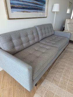 Crate and Barrel gray tufted couch