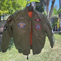 Alpha Industries Youth MA-1 Bomber Jacket with Patches.  This kids' flight jacket is based on the classic MA-1 men's bomber jacket.