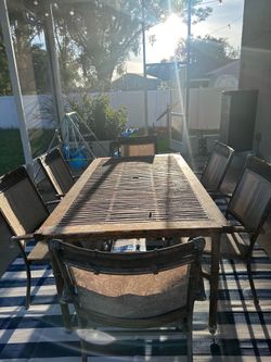 Metal patio dining table with six chairs