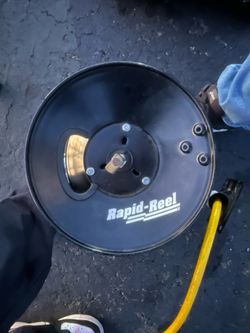 a Rapid Reel brand hose reel. Rapid Reel products are industrial and resi