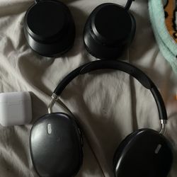 2 Pairs Of Headphones And One Pair Earbuds