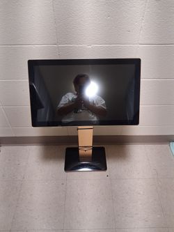3 feet tall, Rose Gold in color, with a monitor placed on top