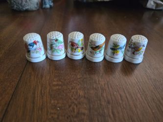 Vintage ceramic bird thimbles.