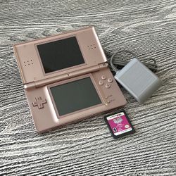 Metallic/Rose Gold Nintendo DS with a game, complete with a stylus & charger.  $40
