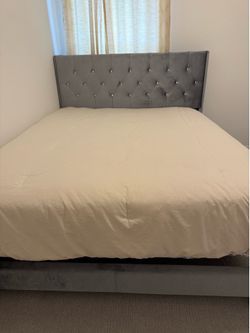 Queen bed frame with mattress and box spring