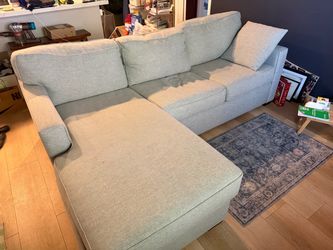 blue / grey living spaces reversible chaise sleeper couch with storage ottoman