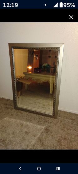 2x3 grayish gold mirror hangs or freestanding good use condition very nice no damage to the mirror