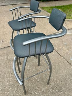 Two Amisco Kris Steel 360 degree Swivel 33” Bar Stools In Powder Gray Like New