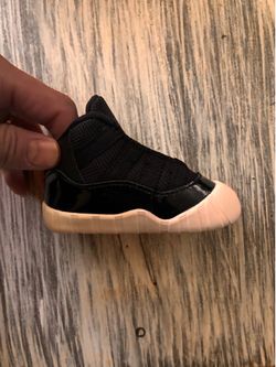 Brand new pair of Jordan 11 crib booties, never worn.
