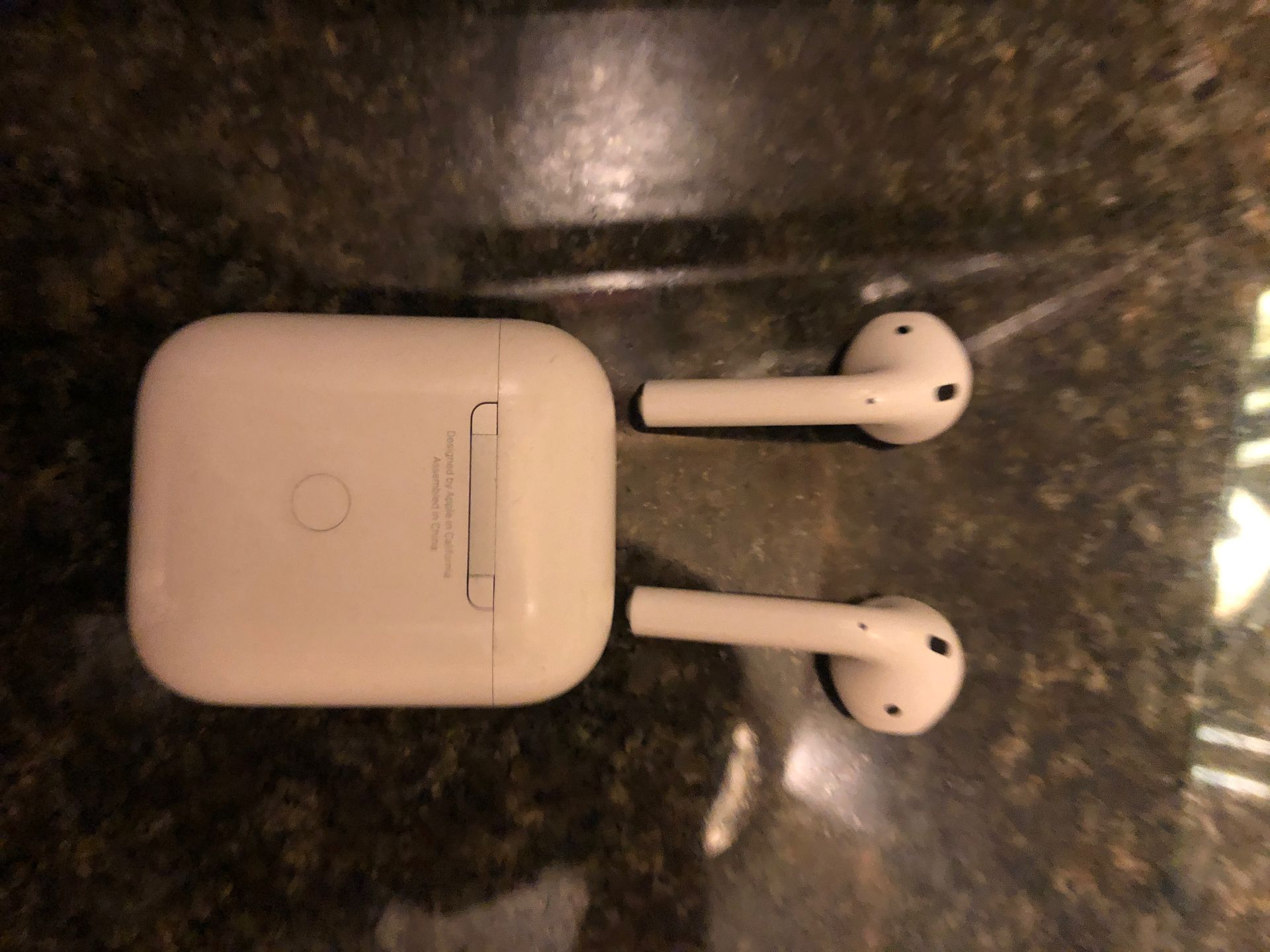 Apple AirPods 2 with wireless charging case.