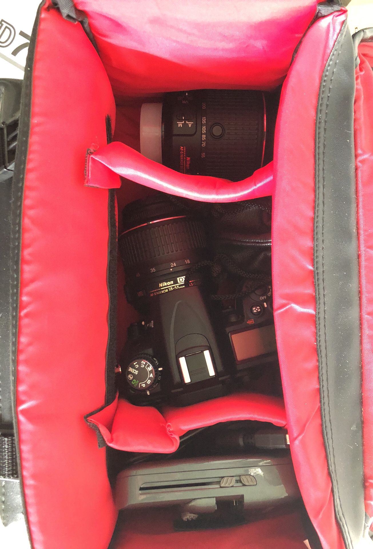 Nikon D7000 camera with 3 lenses, charger, and extra battery set