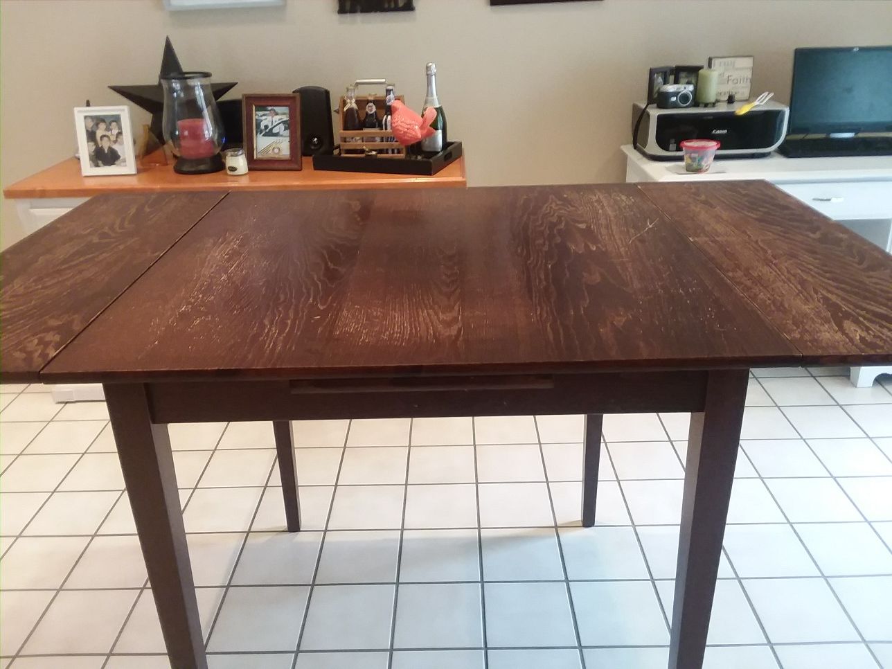 Pier One Pub Table. 3x3 extends to 5x3, height is 36. 10 years old, minor scratches.