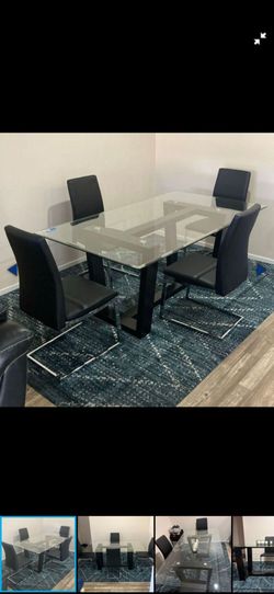 Modern Glass Dining Set with 4 Black Chairs. 70 W x 40 D x 30 H