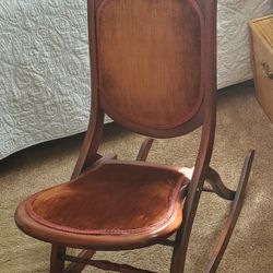 Antique folding rocking chair.